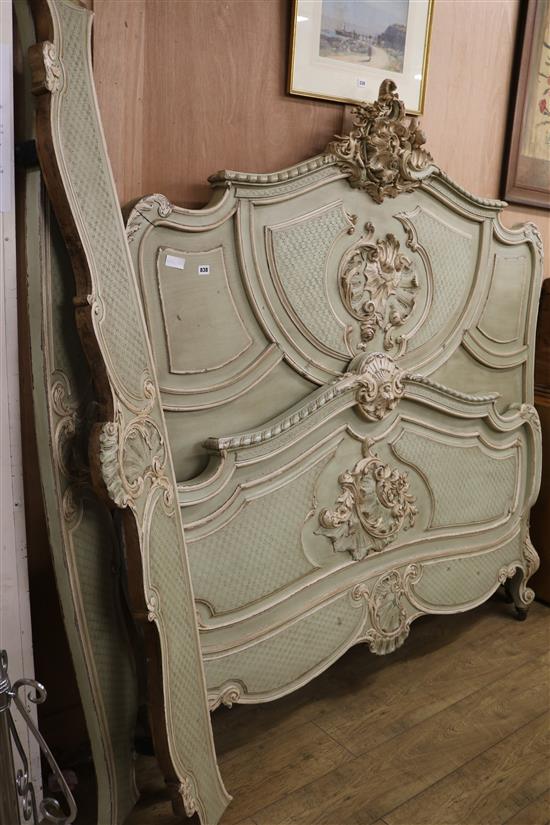 A Louis XV style carved and painted walnut bed frame W.172cm